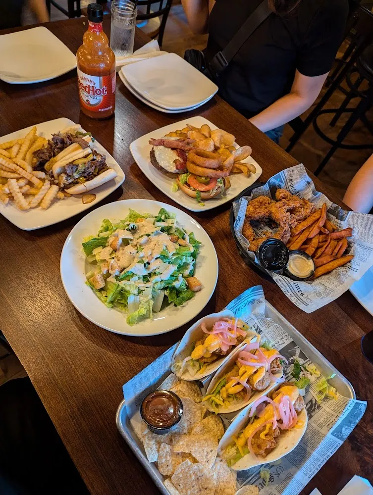 Philly Cheese Steak Spike Burger Ceasar Salad Bang Bang Shrimp Tacos and Chicken Tenders